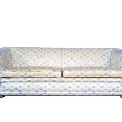 Beige sofa with green flowers