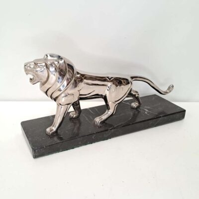 Chromed lion figure. 05540