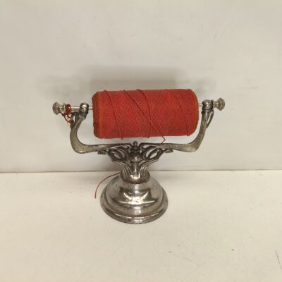 Antique thread dispenser. 09828