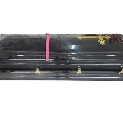 Black high gloss coffin features gold hardware and a gold cross detail rental for events, advertising, films and series.