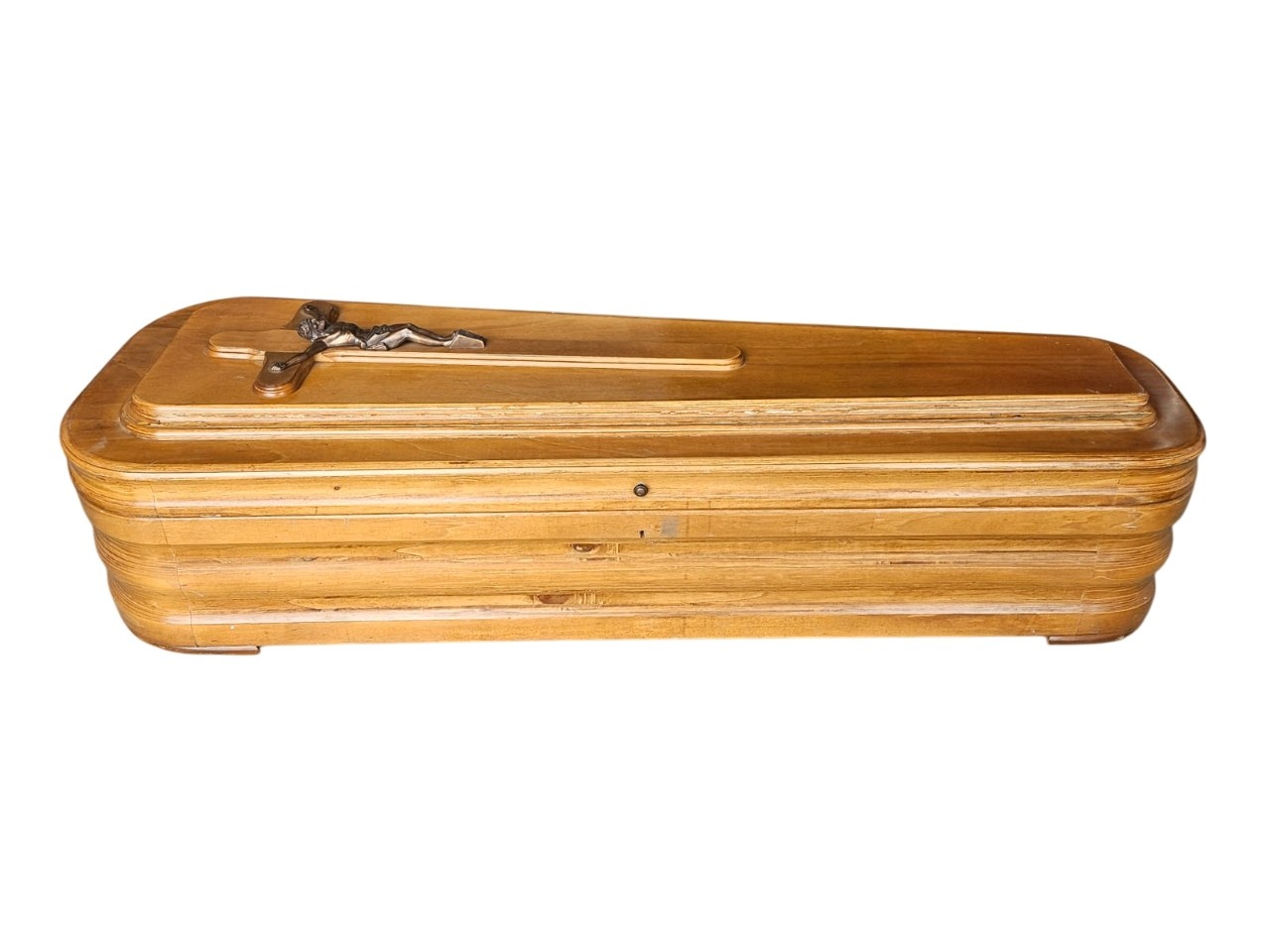 Classic style wooden coffin with a natural finish and a metal cross on the lid rental for events, advertising, films and series.