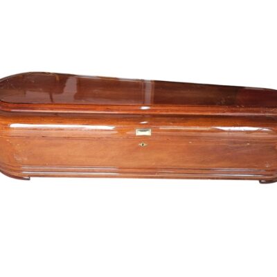 Wooden coffin coffin with a high gloss varnished finish, commonly known as a round or elliptical shaped coffin for hire for events, advertising, films and series.