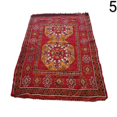 Moroccan Berber rug from the region of M'Rirt, hand-woven with wool in a predominantly red and yellow geometric design, for rent for events, advertising, films and series.