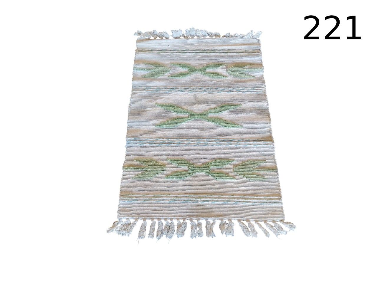 Rug is a hand-woven röllakan style rug with geometric motifs and fringes for rent for events, advertising, films and series.
