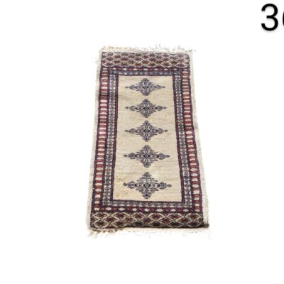 Oriental style corridor carpet, possibly of Pakistani or Afghan origin, with a traditional geometric design, for rent for events, advertising, films and series.
