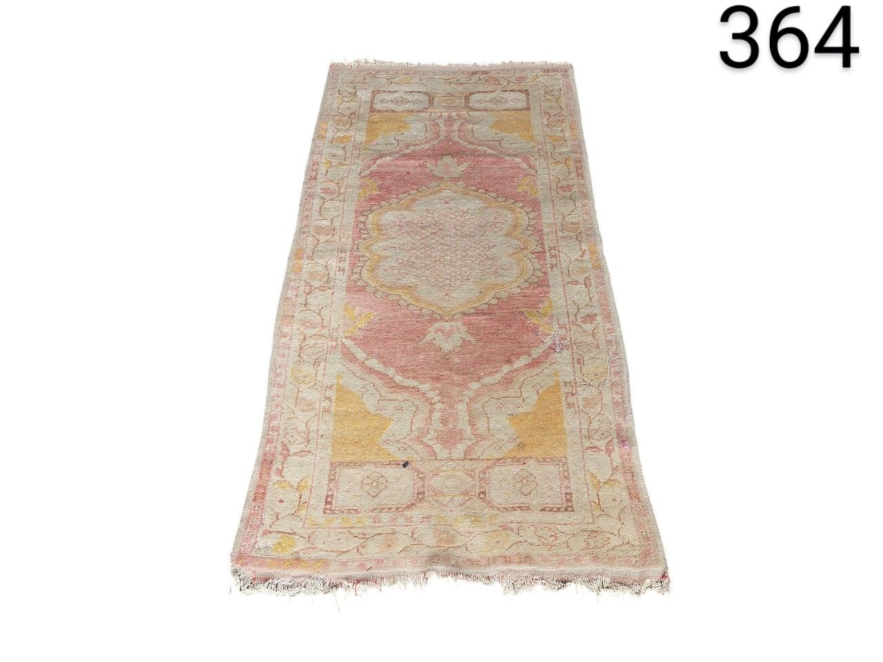 Turkish Oushak vintage hand knotted wool rug with a geometric design and faded pastel shades for rent for events, advertising, films and series.