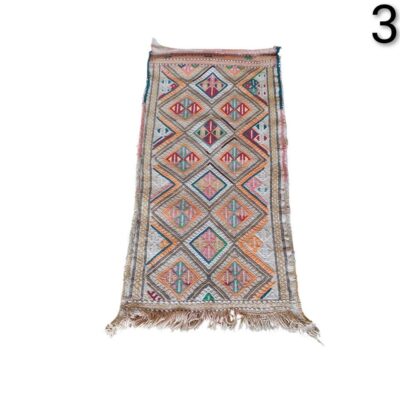 Moroccan Berber Kilim Zemmour vintage carpet with colourful geometric patterns for rent for events, advertising, films and series.