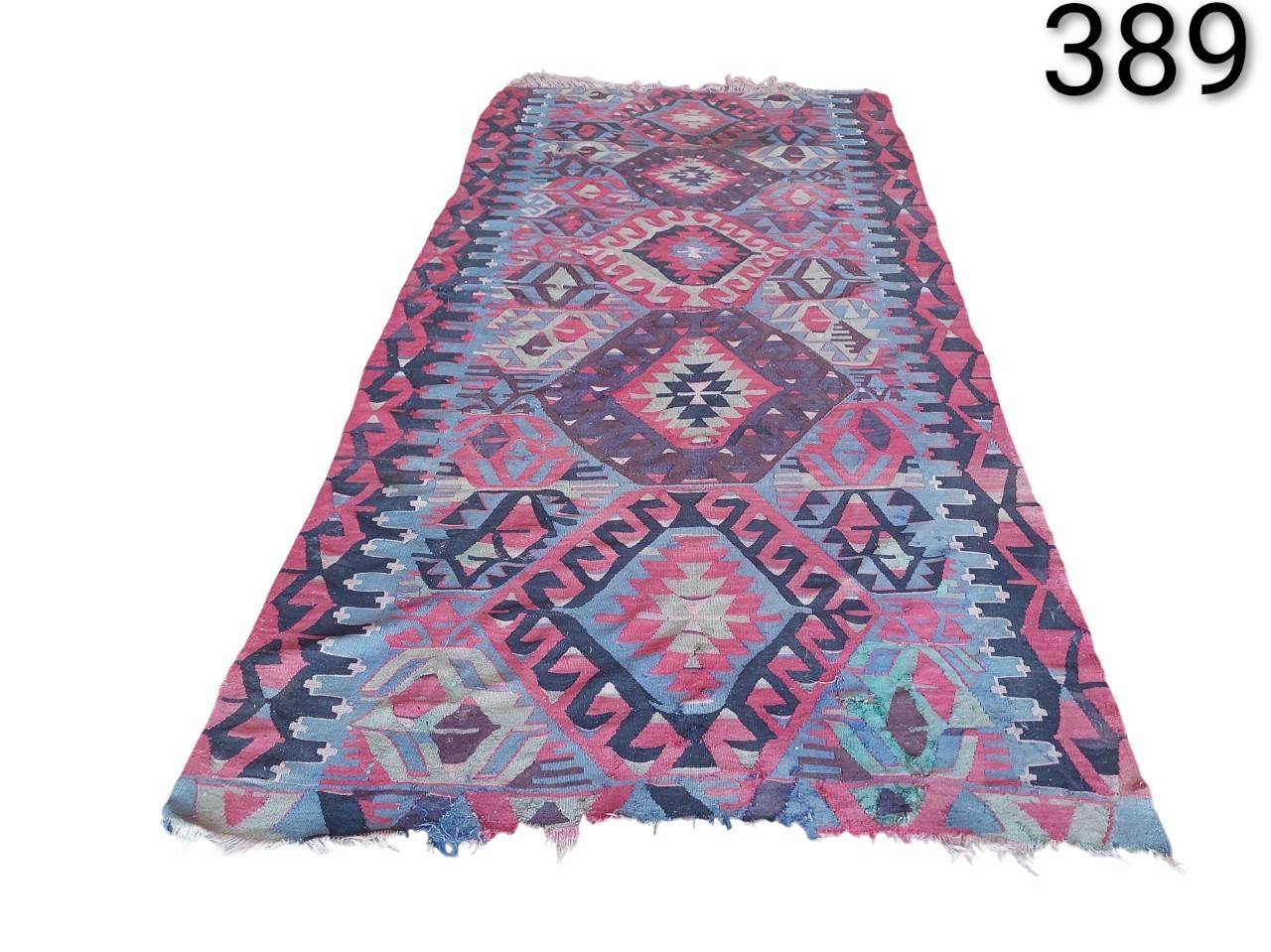 Turkish Kilim vintage wool rug pink and purple colour for rent for events, advertising, movies and series