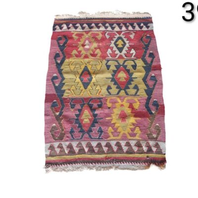 Vintage Turkish Kilim rug made of wool with colourful geometric patterns for rent for events, advertising, films and series.