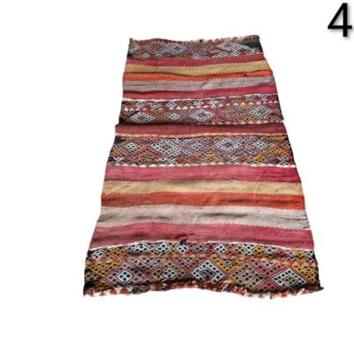Vintage Turkish Kilim hand-woven wool rug, characterised by its geometric patterns and vibrant colours, for rent for events, advertising, films and series.