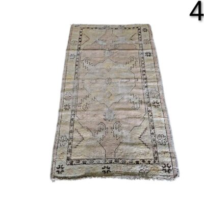 Vintage Turkish Oushak wool rug with geometric pattern in beige and brown tones for rent for events, advertising, films and series.