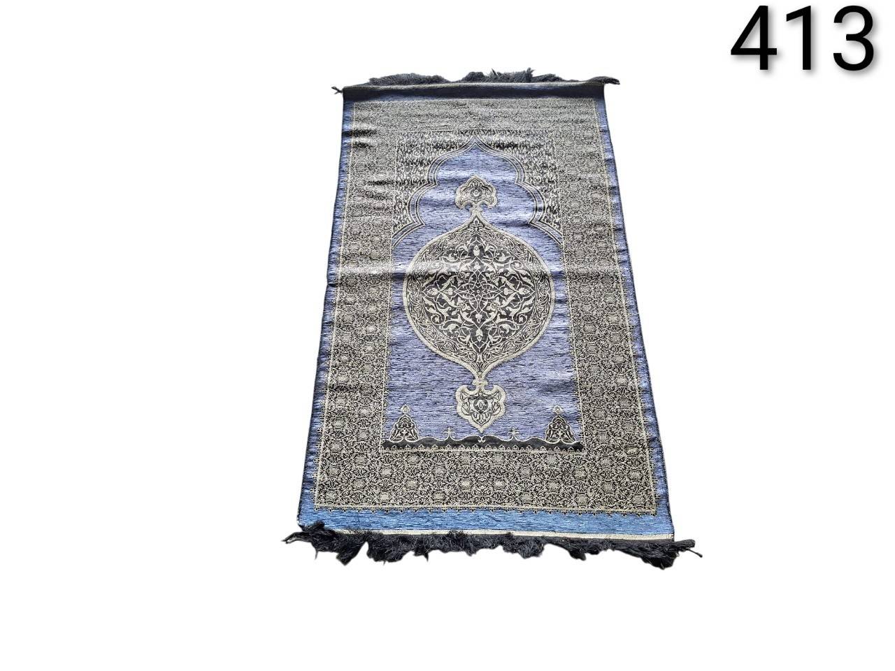 Muslim prayer rug of the brand BAYKUL or EDUS, designed in Turkish style with a blue and black pattern for rent for events, advertising, films and series.