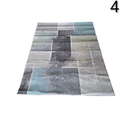 Alfombra moderna de la marca Paco Home con diseño de cuadros geométricos en tonos grises y turquesa alquiler para eventos, publicidad, peliculas y series