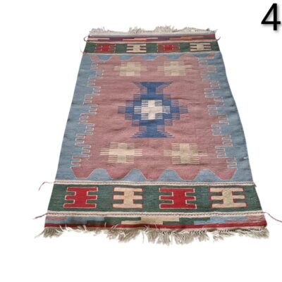 Vintage Turkish Kilim rug from Anatolia, hand-woven with geometric patterns in blue and pink tones, for rent for events, advertising, films and series.