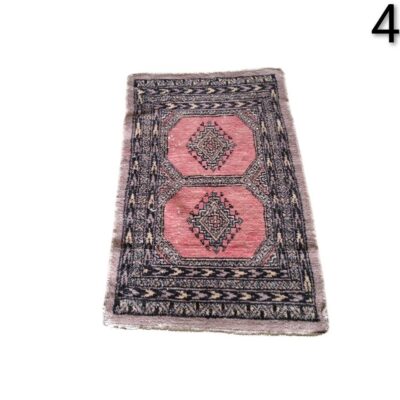 Vintage handmade wool rug, possibly Pakistani or Bukhara style with a geometric pink design for rent for events, advertising, films and series.