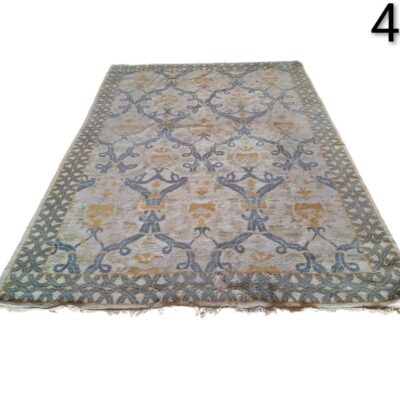 Turkish hand knotted wool Oushak rug, featuring a vintage design in beige, blue and orange tones, for rent for events, advertising, films and series.