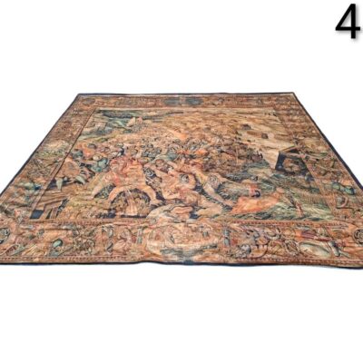 16th century Flemish carpet, possibly from Brussels, depicting a battle scene, for rent for events, advertising, films and series.