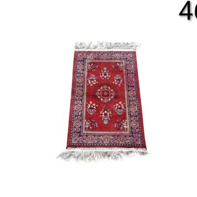 Ethnic style prayer rug with geometric and floral motifs in red tones for rent for events, advertising, films and series.