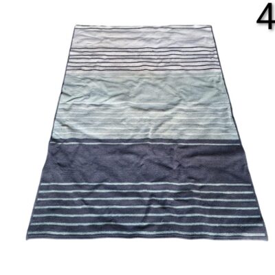 Grey and green striped dhurrie rug of the brand Nanimarquina from the Tres Stripes collection for rent for events, advertising, films and series.