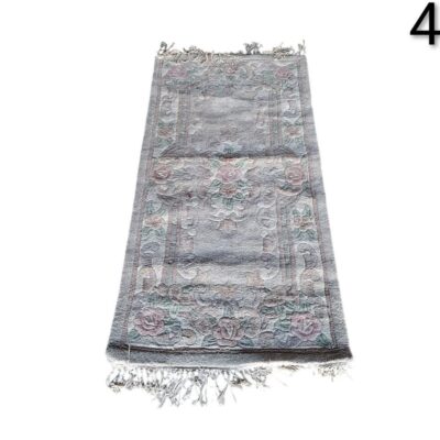 Decorative carpet with vintage floral design with fringes on the edges for rent for events, advertising, films and series.