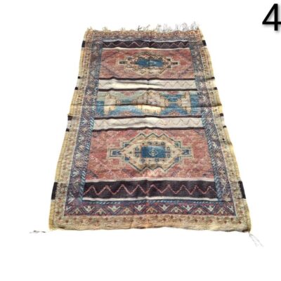 Small handmade wool rug, vintage Turkish Oushak style, with a geometric pattern in shades of brown, pink and blue, for rent for events, advertising, films and series.