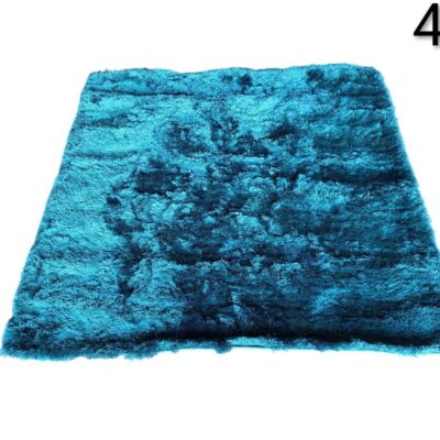 Alfombra benuta Whisper de pelo largo en color turquesa alquiler para eventos, publicidad, peliculas y series