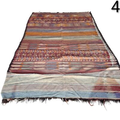 Vintage hand-woven wool Kilim rug with a geometric striped pattern for rent for events, advertising, films and series.