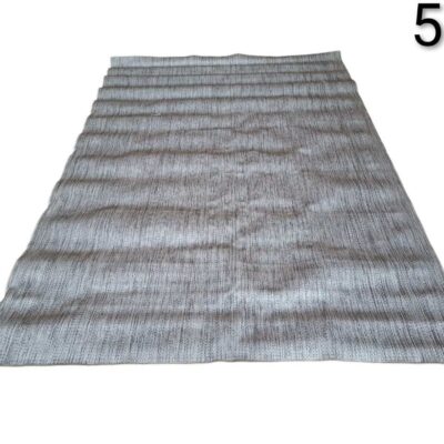 Woven carpet in grey tones with a linear or striped design for rent for events, advertising, films and series.