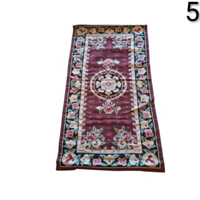 Vintage flat weave Kilim rug, probably of Turkish or Bessarabian origin, featuring intricate floral designs on a dark brown background, rented for events, advertising, films and series.