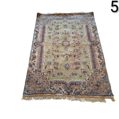Handmade vintage turkish carpet with a floral design in beige and green colours for rent for events, advertising, films and series.
