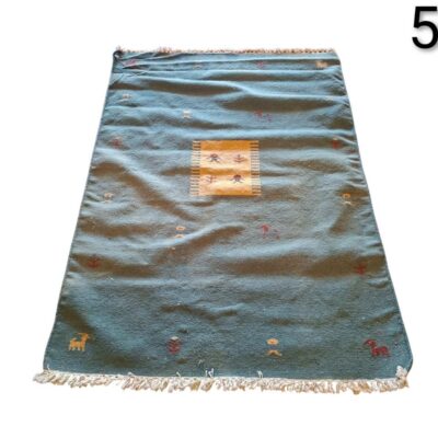 Berber or gabbeh style woollen carpet with figurative design for rent for events, advertising, films and series.