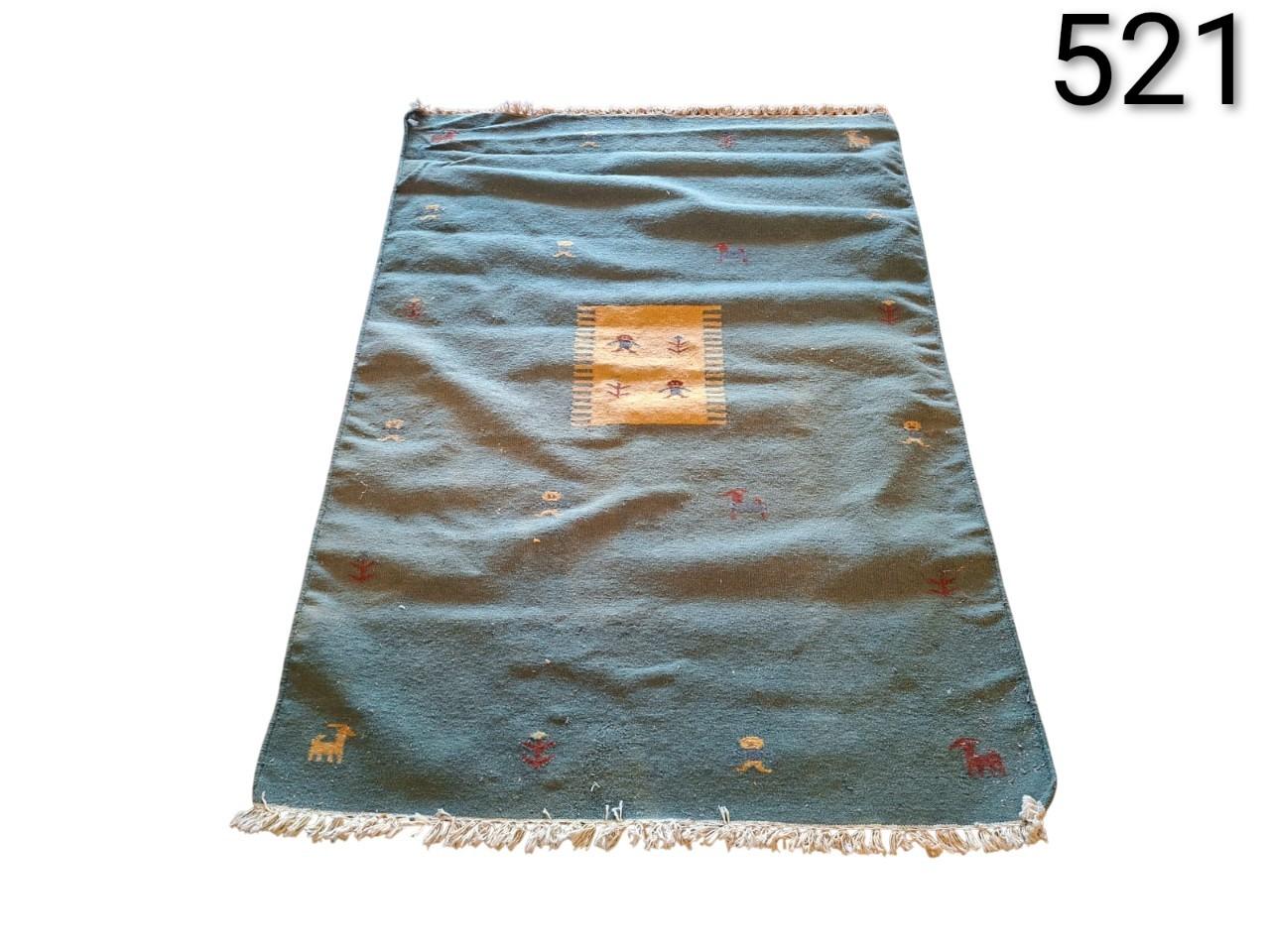 Berber or gabbeh style woollen carpet with figurative design for rent for events, advertising, films and series.
