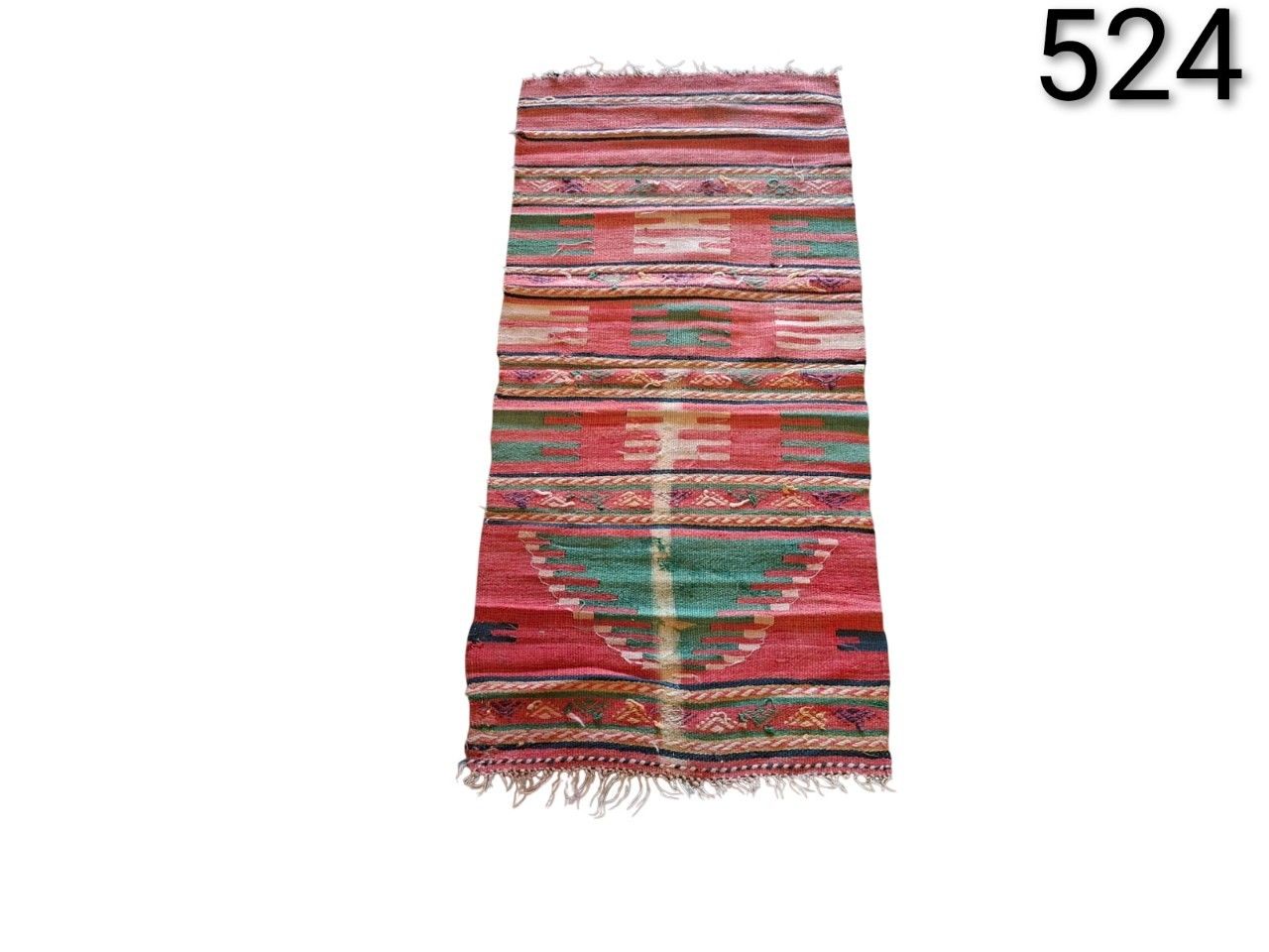 Turkish wool kilim carpet with colourful geometric patterns for rent for events, advertising, films and series.