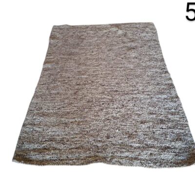 Hand-woven wool rug with a mottled design in neutral tones such as brown and grey, similar to models from brands such as Classic Collection or Linie Design for rent for events, advertising, films and series.