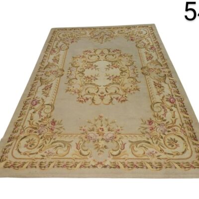Hand-woven woollen Aubusson style woollen rug with classic floral design for hire for events, advertising, films and series.