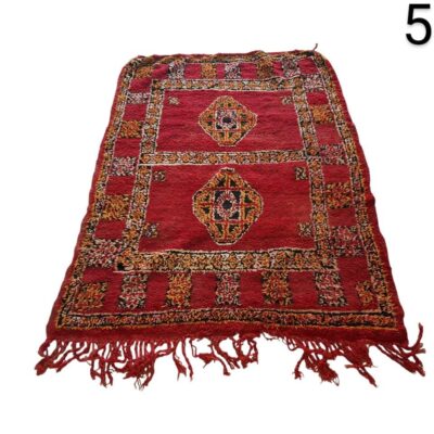 Moroccan Berber vintage handmade rug with red wool and geometric patterns for rent for events, advertising, movies and series.