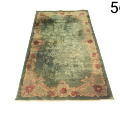 Chinese Art Deco vintage carpet from the 1920's with a green floral design for rent for events, advertising, films and series.