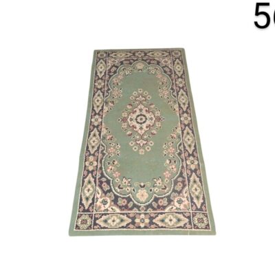 Oriental design carpet with floral pattern and shades of green, pink and cream for rent for events, advertising, films and series.