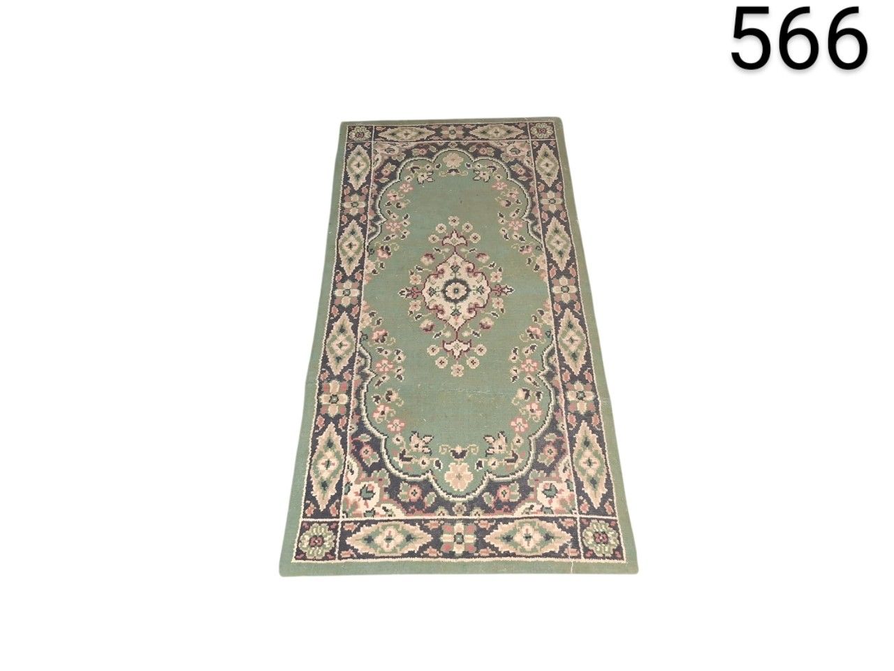 Oriental design carpet with floral pattern and shades of green, pink and cream for rent for events, advertising, films and series.