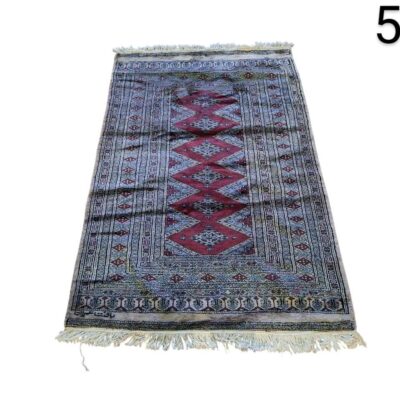 Persian hand knotted woollen carpet with classic Bukhara design in red and beige tones for rent for events, advertising, films and series.