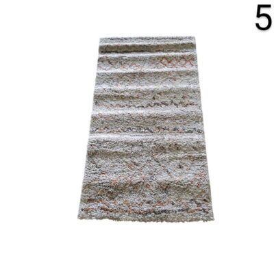 Berber style shaggy rug with geometric pattern and fringes for rent for events, advertising, films and series.