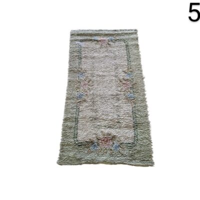 Hand-woven vintage wool rug with a floral design for rent for events, advertising, films and series.