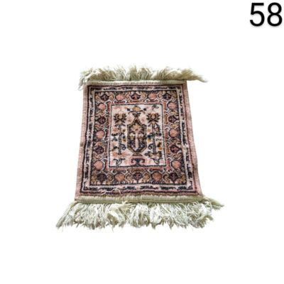 Hand knotted cashmere rug with an intricate floral design in peach and beige tones for rent for events, advertising, films and series.