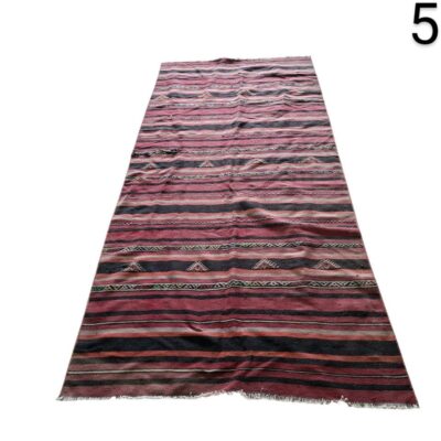 Handmade Afghan Kilim rug with red wool and tribal geometric stripes for rent for events, advertising, films and series.