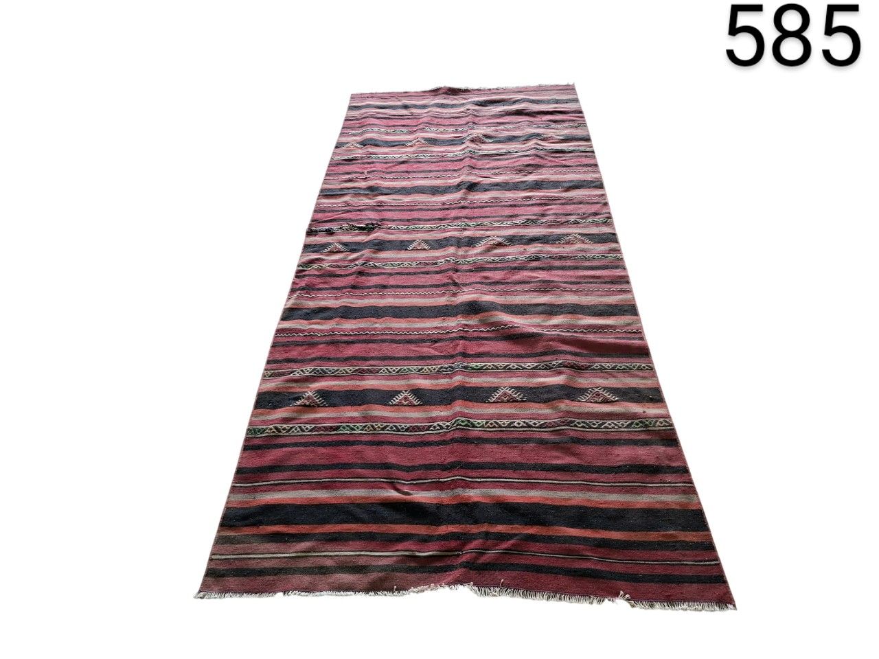 Handmade Afghan Kilim rug with red wool and tribal geometric stripes for rent for events, advertising, films and series.