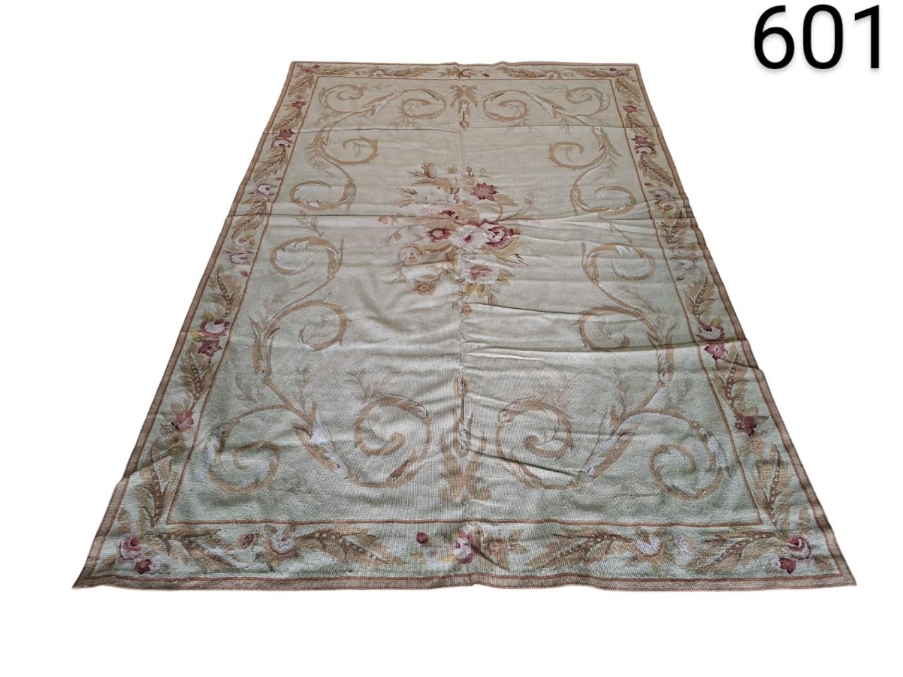 Aubusson French style wool carpet with classic floral design in beige and pink tones for rent for events, advertising, films and series.