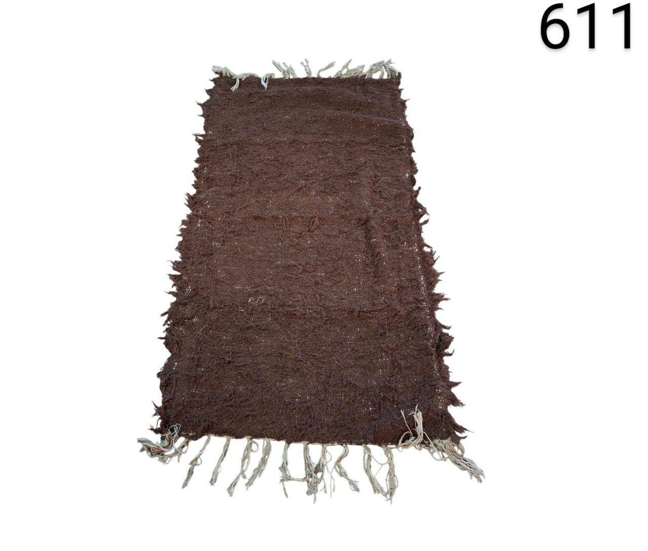 Brown rustic woven carpet with fringes for rent for events, advertising, films and series.