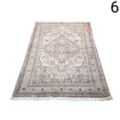 Vintage Turkish wool rug with a traditional medallion design in beige and pastel pink tones for rent for events, advertising, films and series.