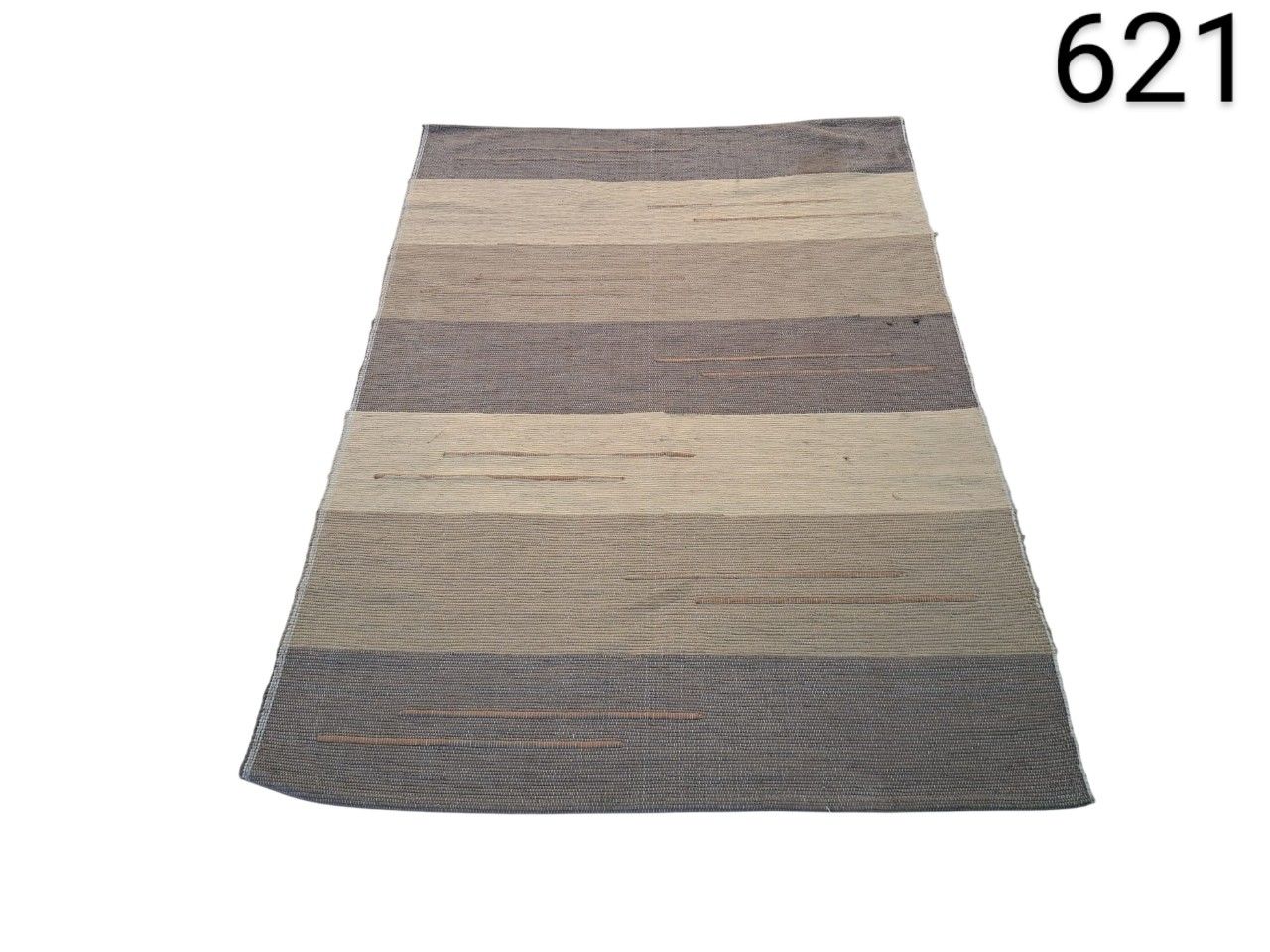 Rectangular nanimarquina rug from the Tres Stripes collection with a design of horizontal stripes in neutral and greyish tones for rent for events, advertising, films and series.