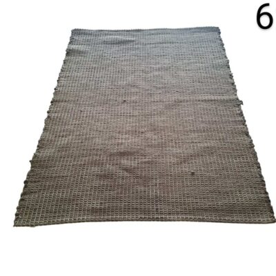 Grey braided carpet with a repetitive geometric texture for events, advertising, films and series.